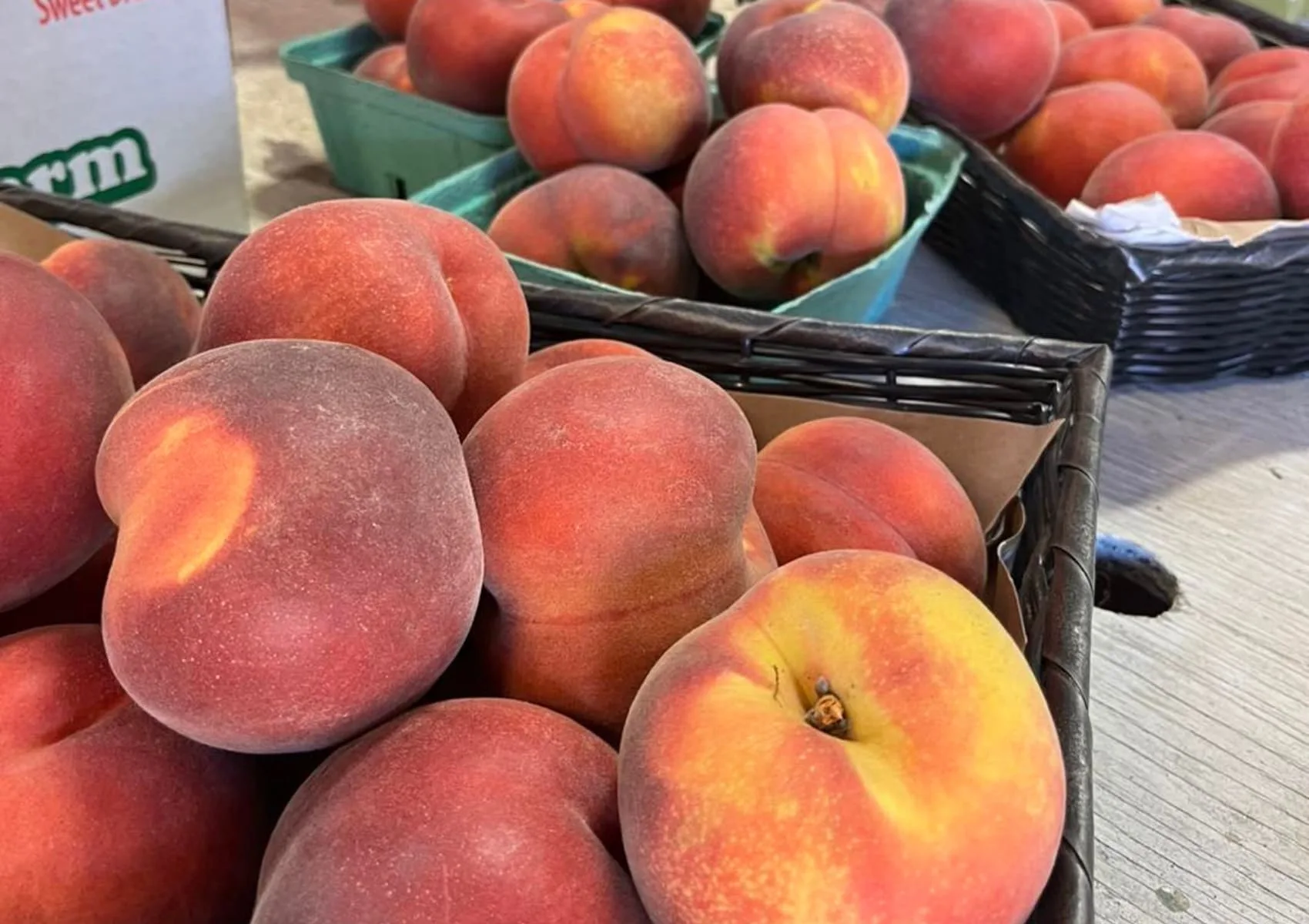 Ripe peaches displayed at the farm store.