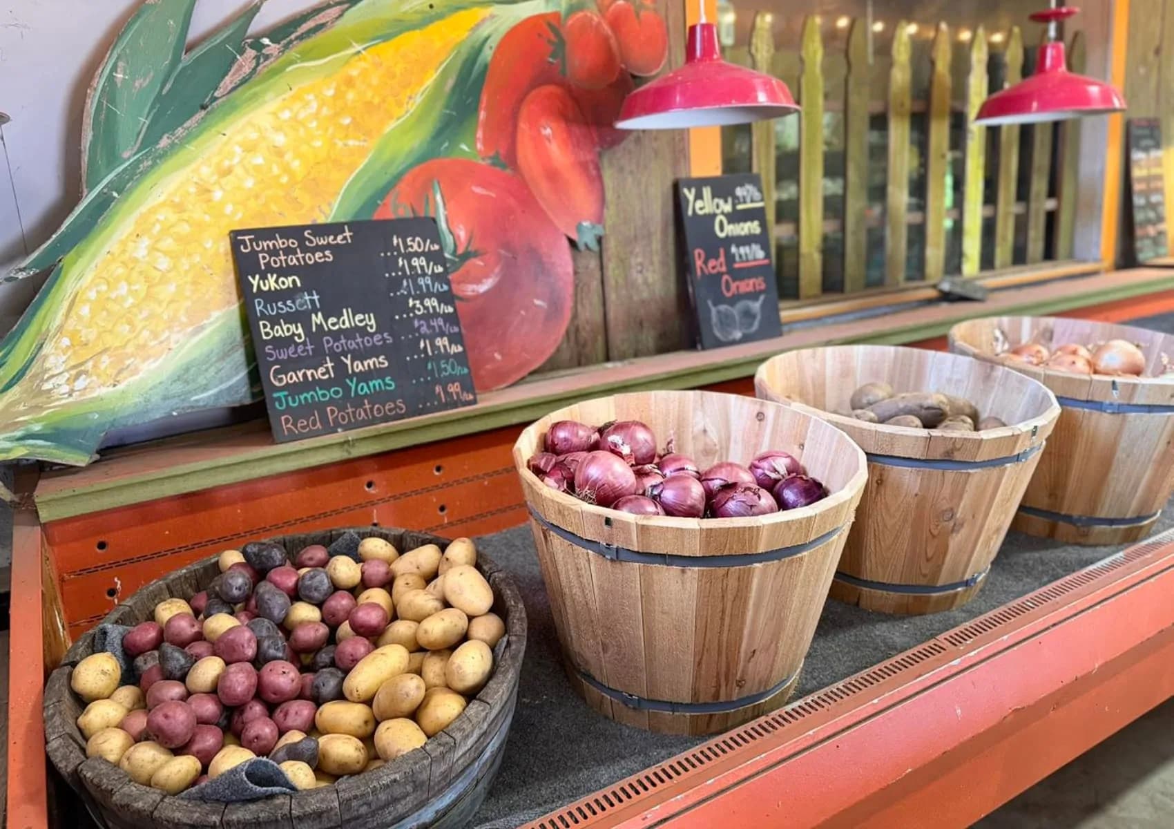 Baskets of potatoes and onions at the farm store.
