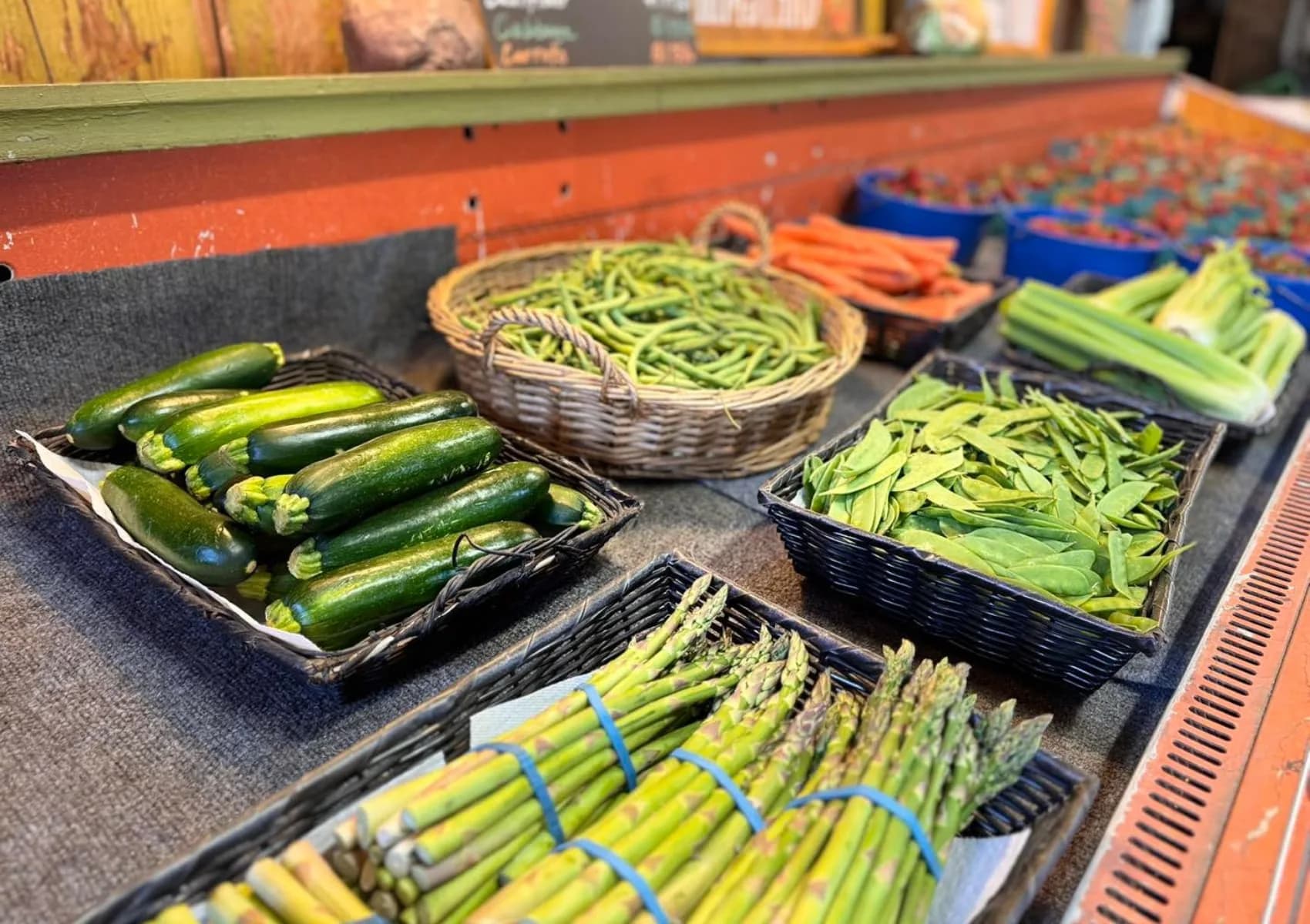 Green vegetables arranged at the farm store.